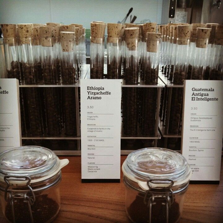 Glass tubes of coffee beans and labeled jars